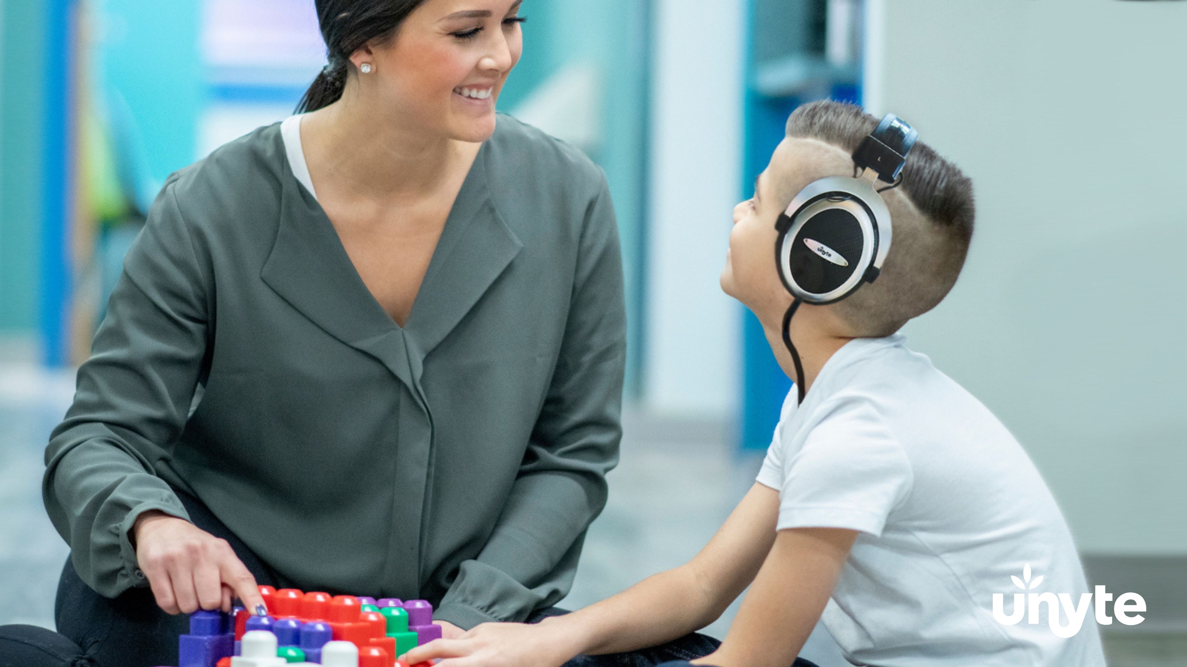 SSP provider guiding a child through a listening session